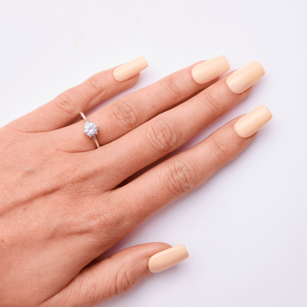 Peachy nude gel polish applied on nails using Lola Lee Pretty Darn Good