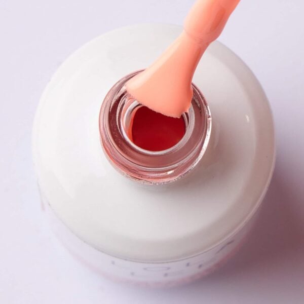 Stuck On Smiles' Pastel Orange Gel Polish in a bottle