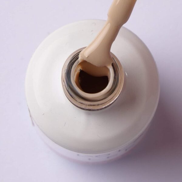 Brush lifting mid-toned chocolate milk brown gel polish from the bottle