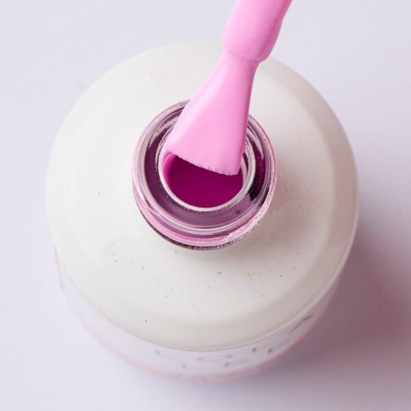 top bottle view of Lola Lee GP Light pink gel nail polish bottle with matching color swatch, soak-off formula Open bottle of pink gel nail polish with brush applicator on white background. 037 - Not My Problem 037 - Not My Problem Hand with long pastel pink gel nail polish manicure and a solitaire ring on white background 037 - Not My Problem