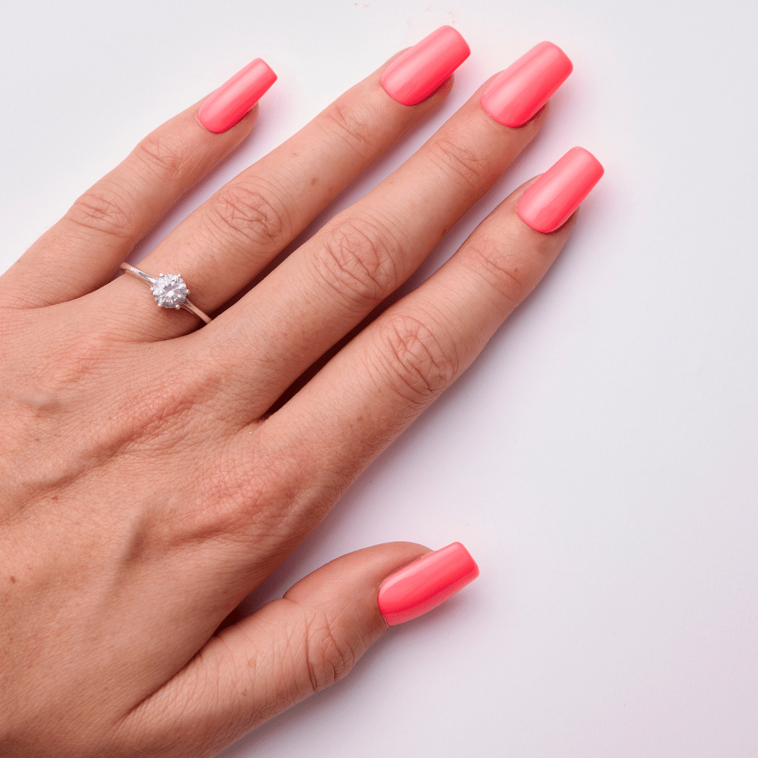 Glossy vibrant pink manicure on natural nails